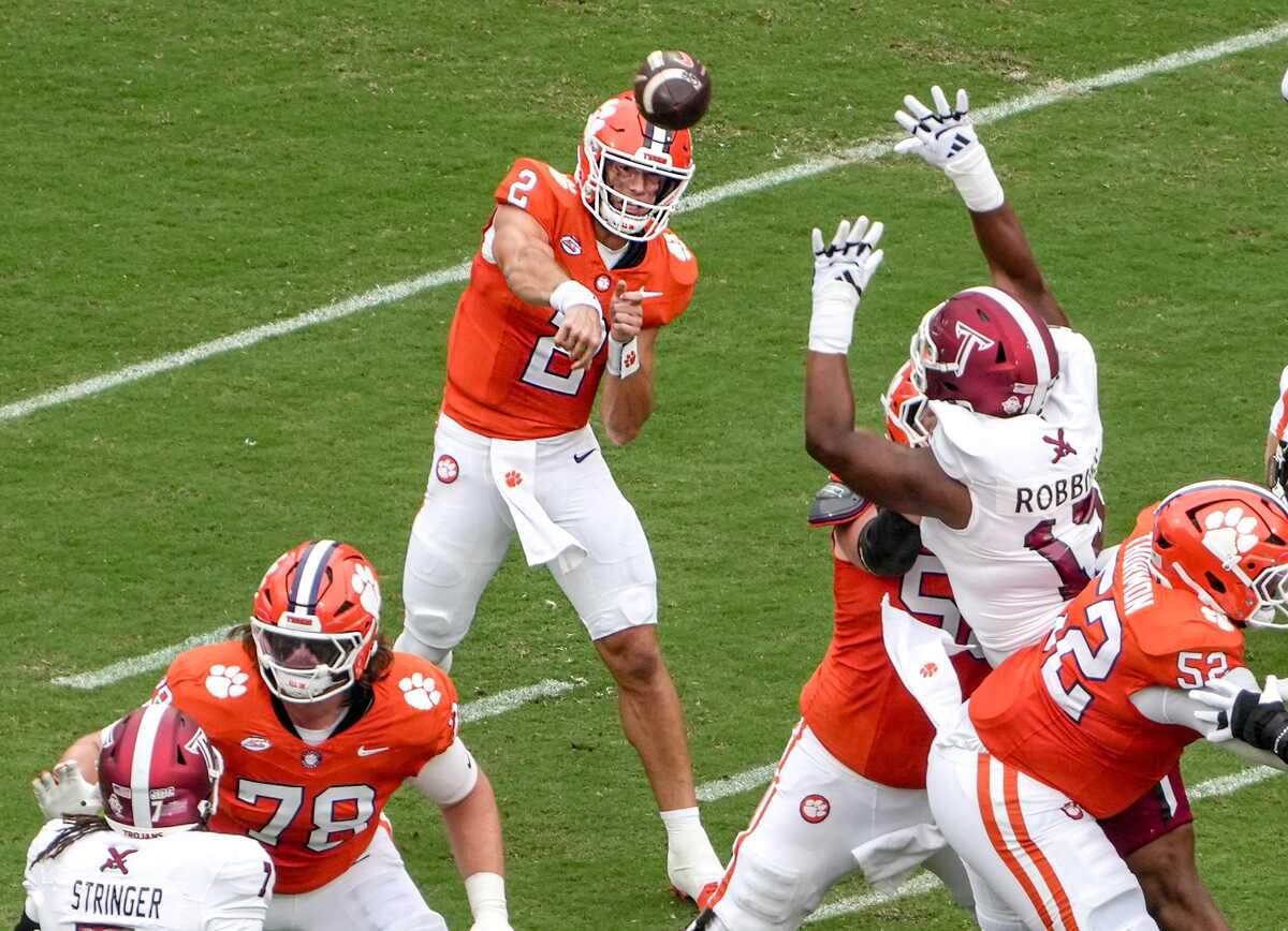 Clemson quarterback Cade Klubnik (2) passes near Troy Trojans defense during the first quarter at Memorial Stadium in Clemson, S.C. Saturday, September 6, 2025.