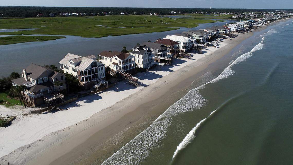 Litchfield Beach on Friday, September 6, 2019 after Hurricane Dorian washed away dunes and destroyed decks in front of the homes. Property owners built seawalls illegally at one point to protect their houses, but state regulators ordered the walls taken down. New seawalls are illegal in South Carolina because they can worsen beach erosion when hit by waves.