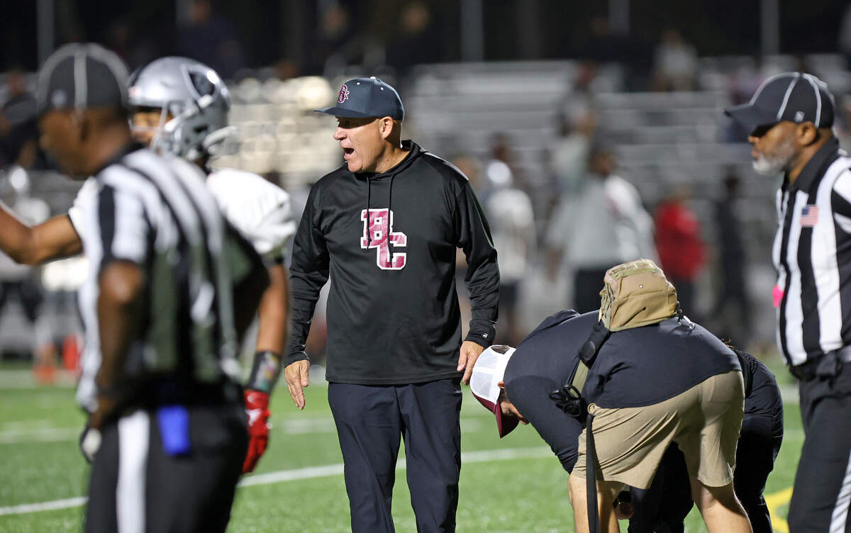 Brookland-Cayce coach Rusty Charpia looks toward the Gray Collegiate sideline as B-C tends to an injured player during their game Tuesday night at Gray.