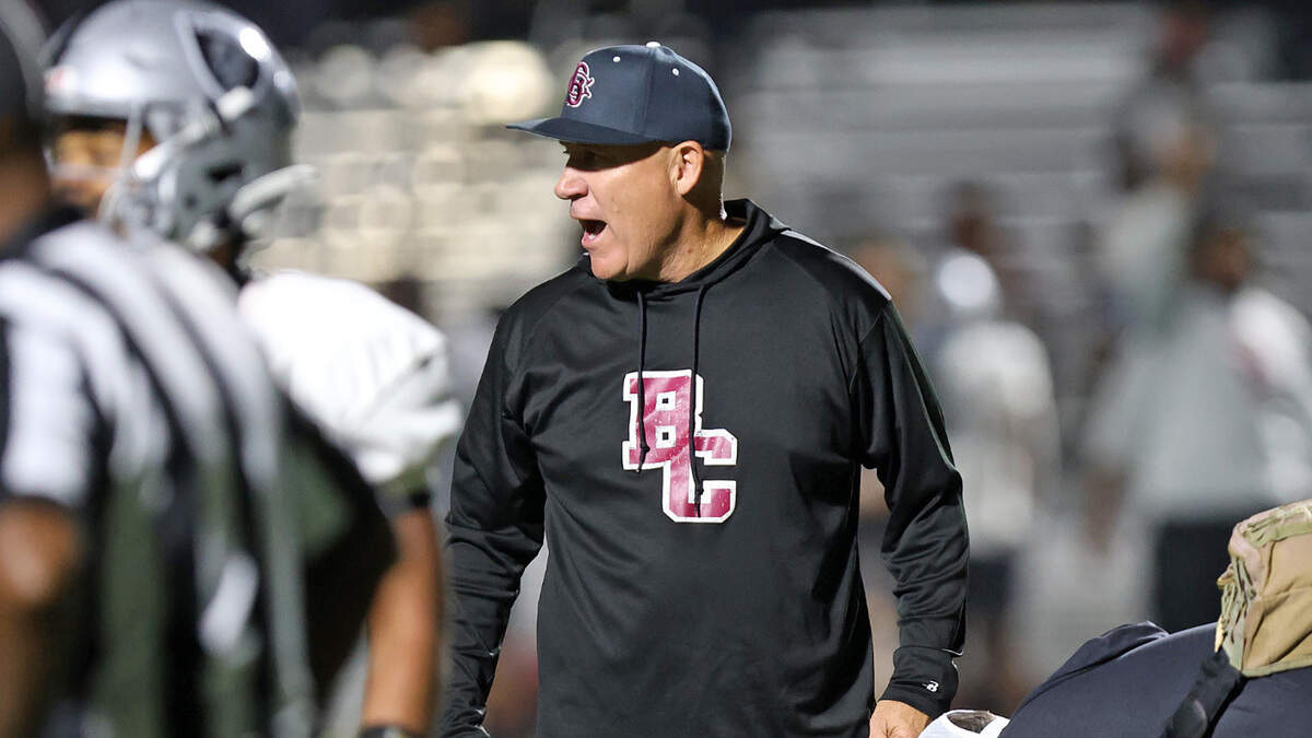 Brookland-Cayce coach Rusty Charpia looks toward the Gray Collegiate sideline as B-C tends to an injured player during their game Tuesday night at Gray.