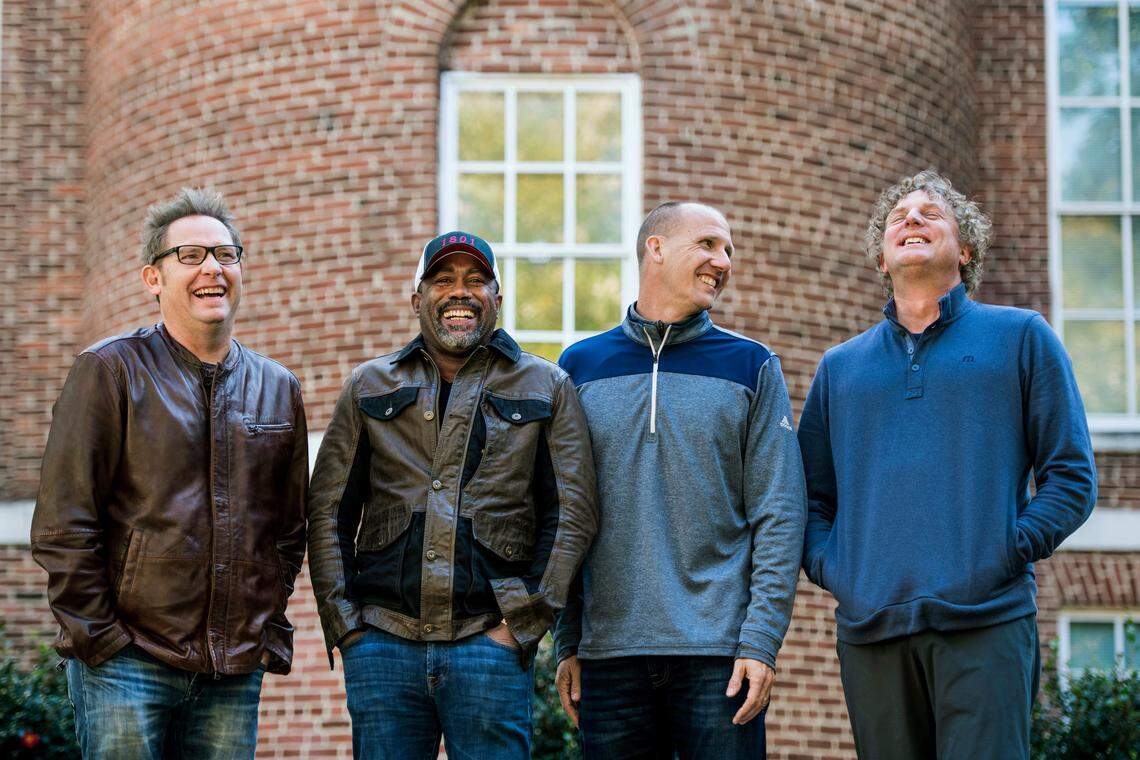 In this Nov. 16, 2018 photo, Dean Felber, from left, Darius Rucker, Jim Sonefeld, and Mark Bryan, of Hootie & the Blowfish, pose for a portrait at the University of South Carolina in Columbia, S.C. The band is returning with a tour and album 25 years after “Cracked Rear View” launched the South Carolina-based rock band. (Photo by Sean Rayford/Invision/AP)