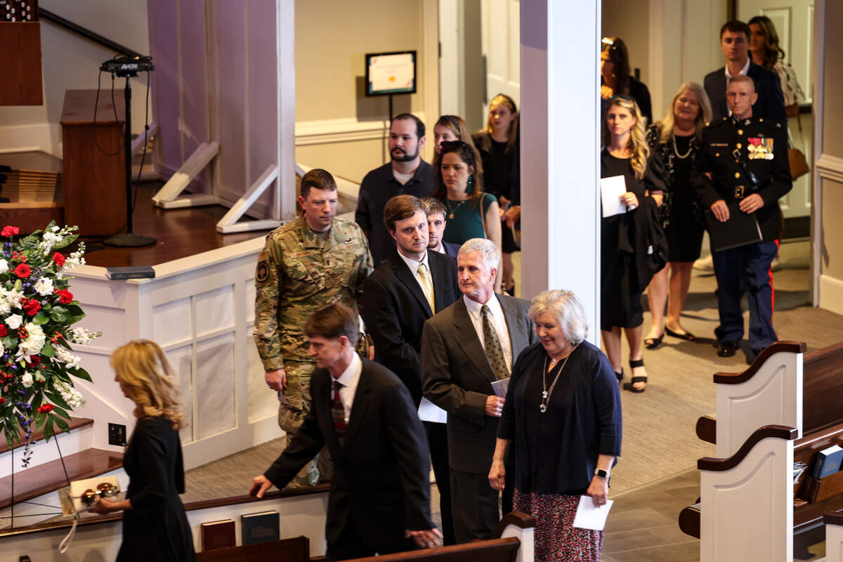 Family members file into a memorial service at Northeast Presbyterian Church in Columbia, for WWII veteran Arthur William Crossland, Jr.