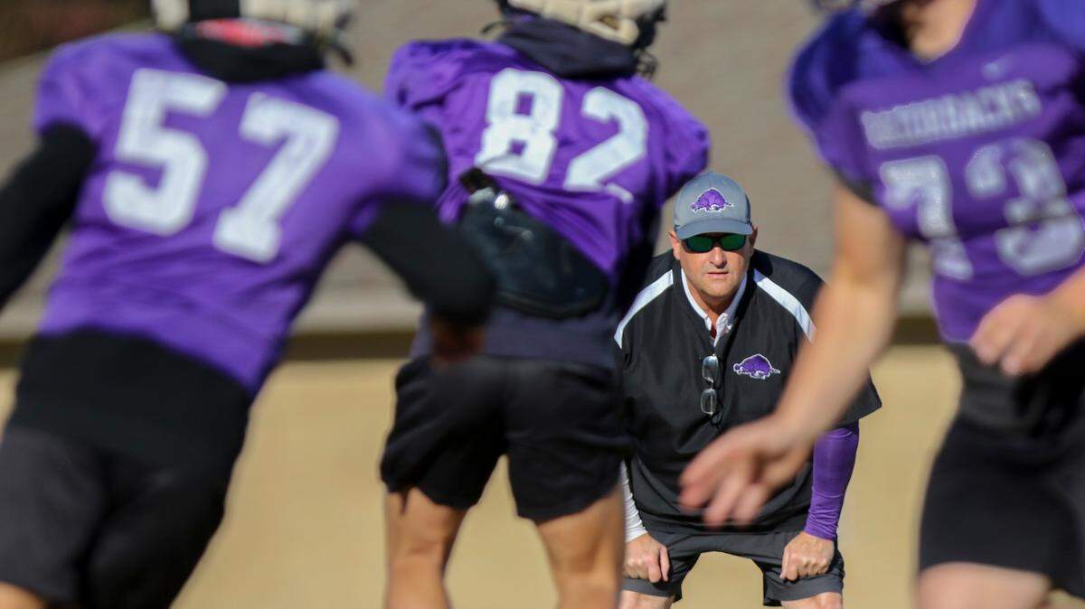 Walhalla football coach Padgett Johnson watches the Razorbacks practice. Johnson has volunteered to coach the 3-A Razorback football team for the past seven seasons.