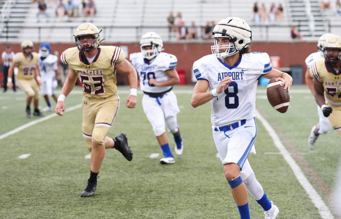 Airport quarterback Jesse Hoover (8) carries the ball Friday during the Lexington 1 Sports-A-Rama Jamboree.