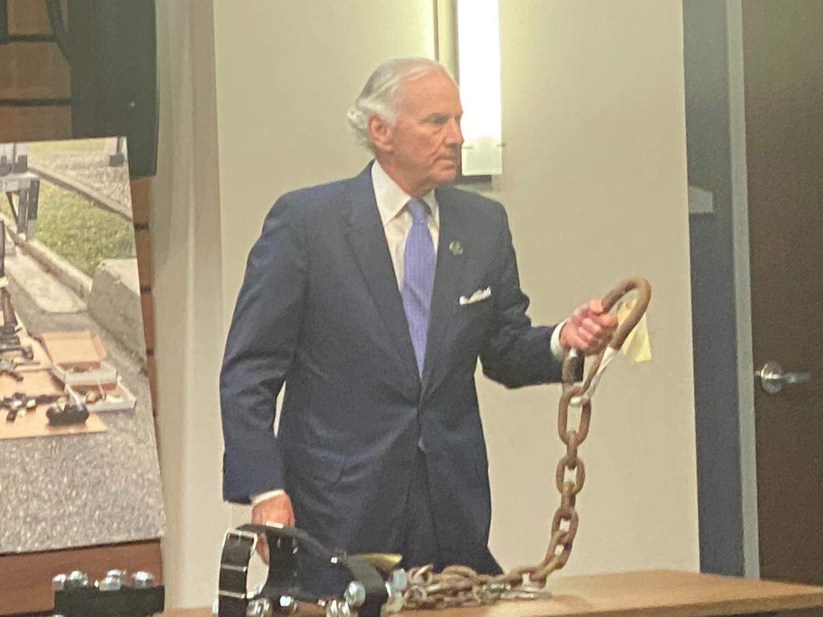 S.C. Gov. Henry McMaster holds a heavy chain used to make fighting dogs stronger. McMaster spoke at a State Law Enforcement Division press conference announcing a crackdown on the blood sport of illegal dog fighting in the state. 