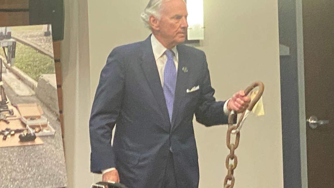 S.C. Gov. Henry McMaster holds a heavy chain used to make fighting dogs stronger. McMaster spoke at a State Law Enforcement Division press conference announcing a crackdown on the illegal blood sport.