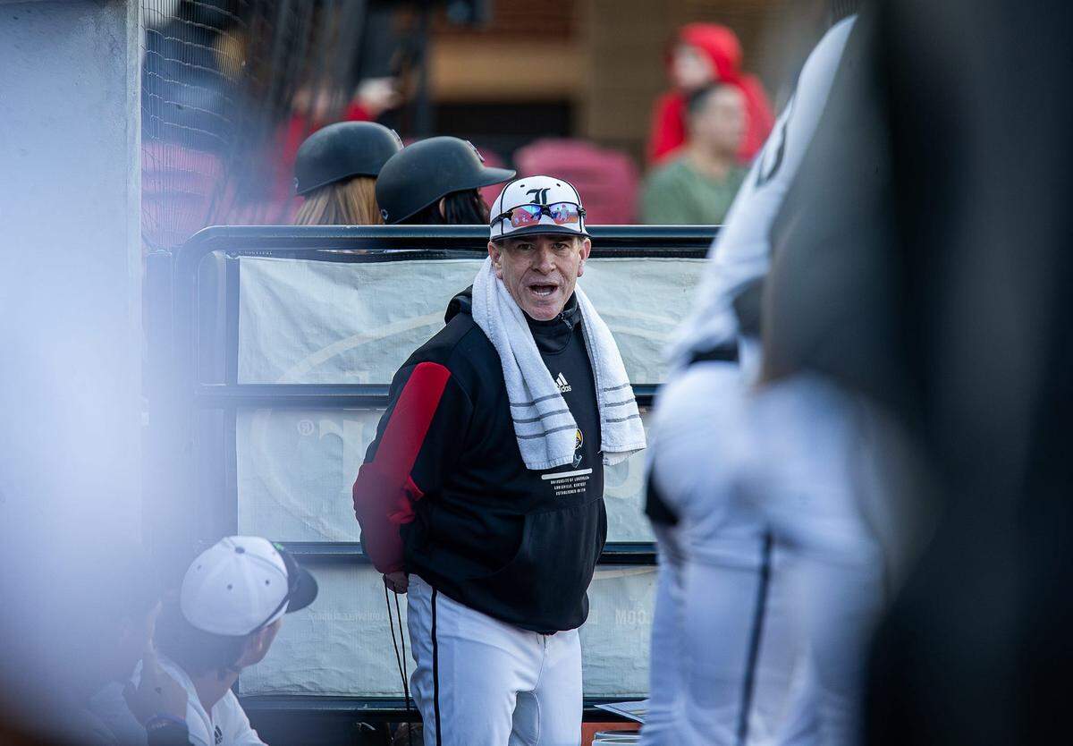 Louisville head coach Dan McDonnell yelled to his team in the dugout as the Cardinals hosted the Xavier Musketeers in Louisville’s home opener of the 2024 season on Wednesday afternoon at Jim Patterson Stadium. Louisville fell to Xavier 9-1. Feb. 21, 2024