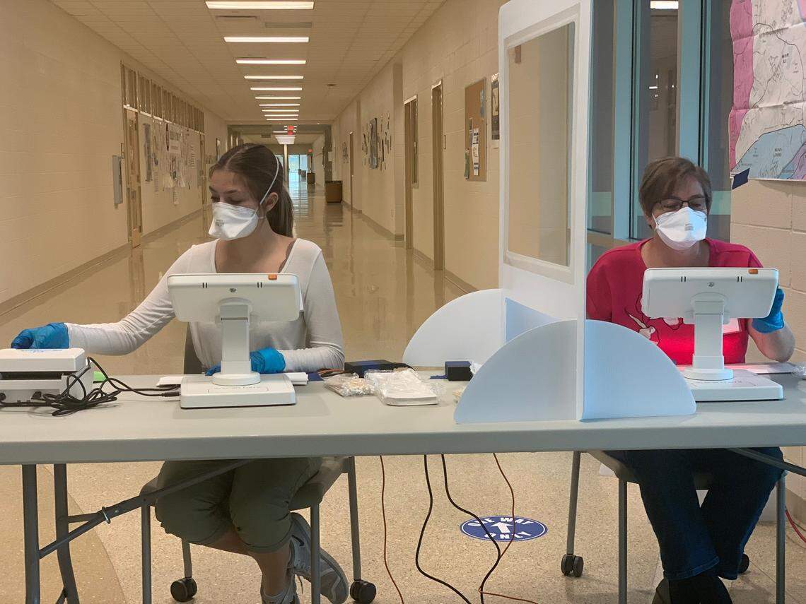 Poll workers Morgan and Susan Yates found the ExpressPoll check-in technology easy to use on Election Day in Lexington.