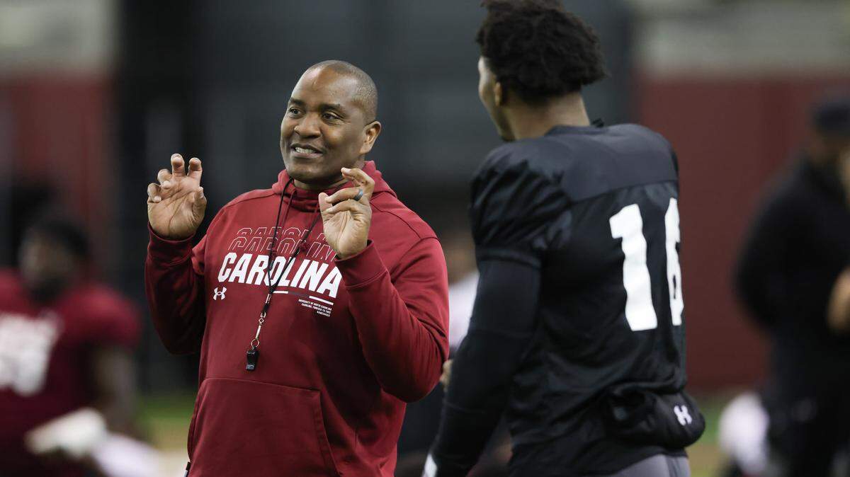 South Carolina defensive coordinator Clayton White speaks with quarterback LaNorris Sellers (16) during practice in Columbia on Wednesday, March 25, 2026.