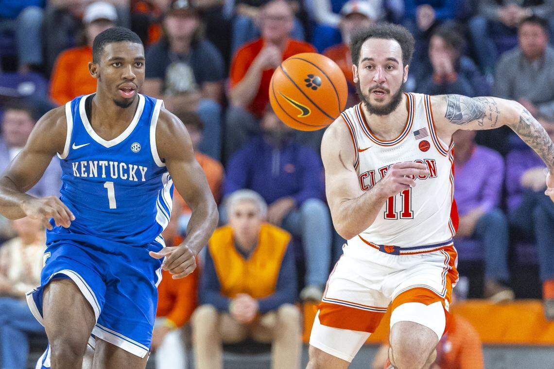Kentucky Wildcats guard Lamont Butler (1) and Clemson Tigers guard Jaeden Zackery (11) chase after a loose ball during a game at Littlejohn Coliseum in Clemson, S.C., on Tuesday, Dec. 3, 2024.