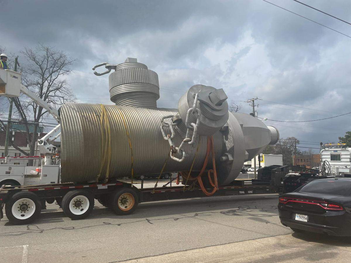 The “Busted Plug” fire hydrant sculpture is moved from its longtime spot on Taylor Street on Thursday, Feb. 23