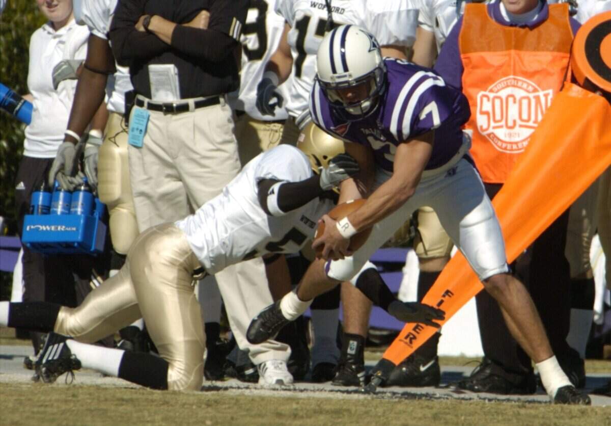 Furman’s Justin Stepp (7) is run out of bounds by Wofford’s Brian Kemp at Paladin Stadium in Greenville, SC, Nov. 12, 2005.