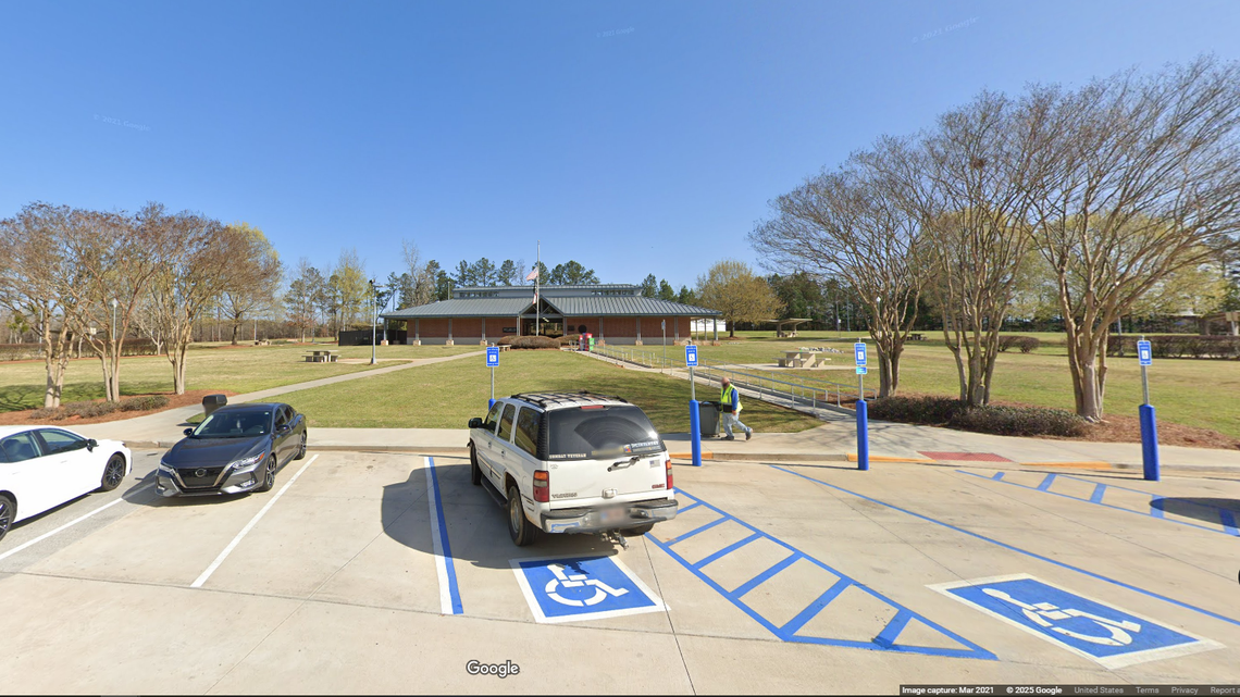 A woman taken from her home in South Carolina was able to alert a passerby at a rest stop on Interstate 20 in Morgan County, Georgia, officials say.