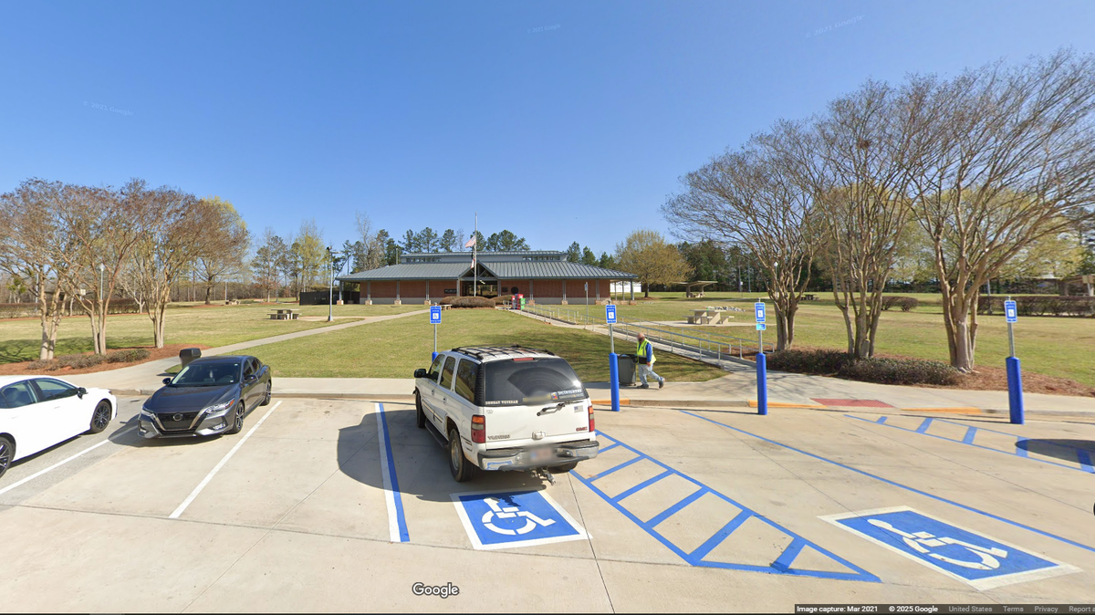 A woman taken from her home in South Carolina was able to alert a passerby at a rest stop on Interstate 20 in Morgan County, Georgia, officials say.