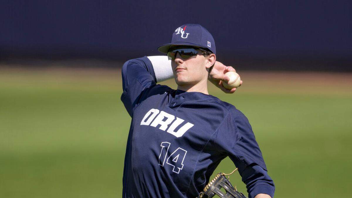 Oral Roberts infielder Caleb Denny (14) throws during an NCAA baseball game against Radford on Sunday, Feb. 20, 2022, in Mobile, Ala.