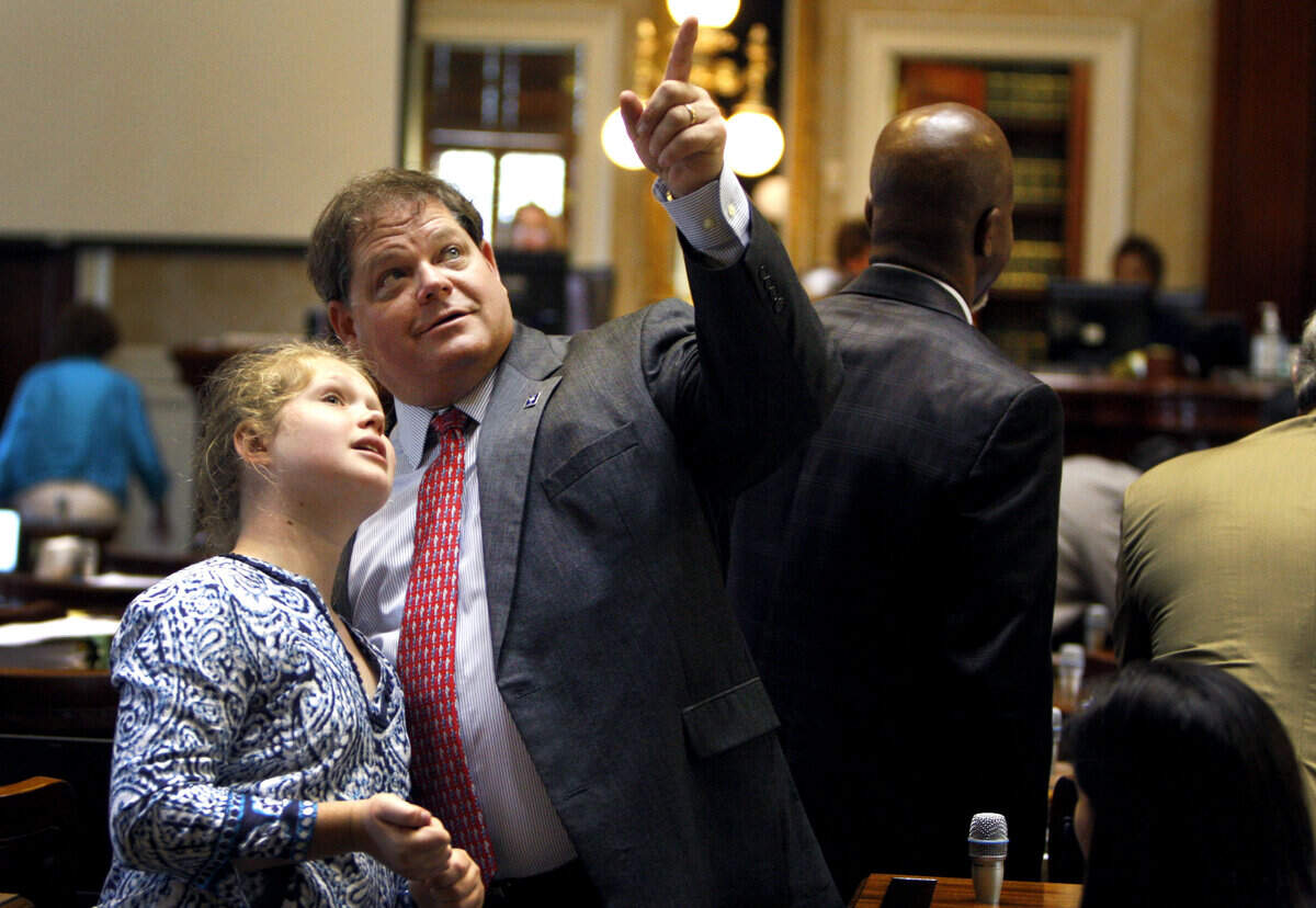 Rep. Weston Newton, Beaufort and Jasper Counties, shows his daughter, Reedy Newton, 12, where USC’s Jadeveon Clowney is sitting in the statehouse gallery. Clowney was presented with a proclamation by Rep. Todd Rutherford, house Minority Leader, D-Richland.