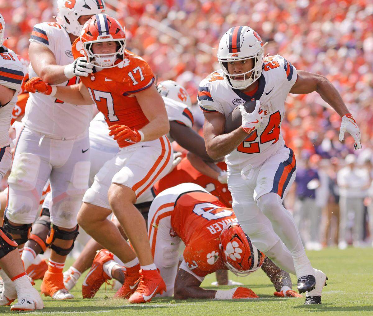 Syracuse running back Will Nixon (24) runs for at touchdown in front of Clemson linebacker Wade Woodaz (17) during first-half action in Clemson, S.C on Saturday, Sept. 20, 2025.