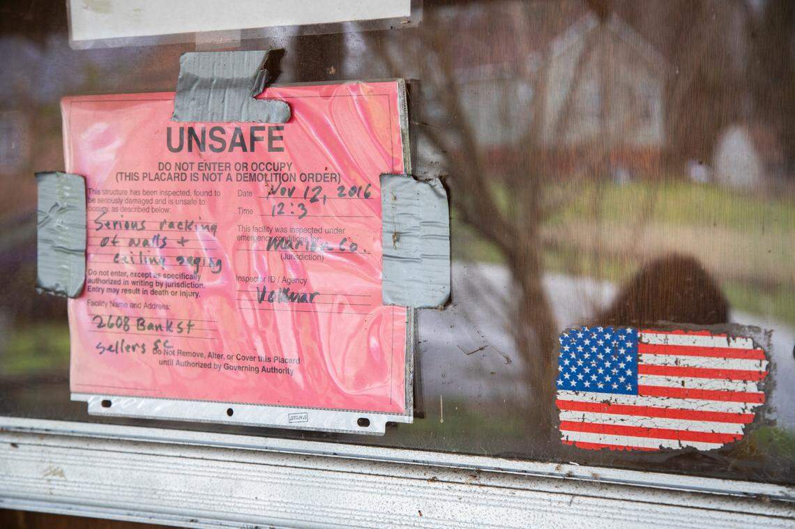 Sellers, South Carolina Mayor Barbara Hopkins says homes damaged by repeated flooding and hurricanes have developed mold. Homes marked with the red tag are scattered around the town years after the hurricanes and floods that damaged the homes. .