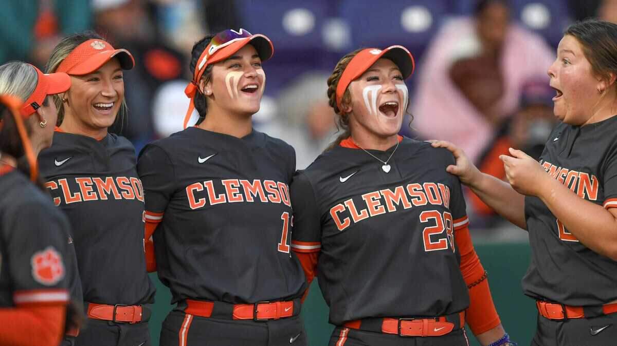 Clemson sophomore Kylee Johnson (3), left, sophomore Julia Knowler (12), senior Maddie Moore (28), and junior Jadeyn Ruszkowski (21) before the softball game with Charlotte at McWhorter Stadium in Clemson, S.C. Tuesday, February 18, 2025.