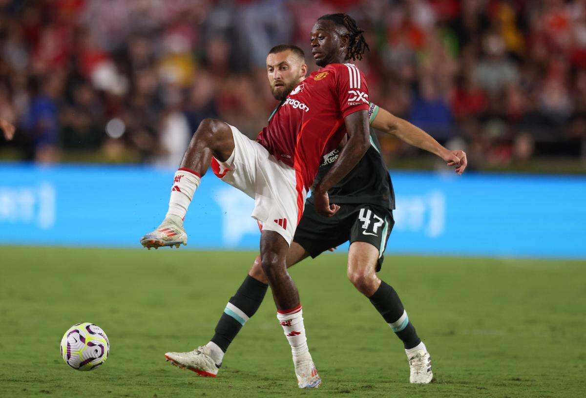 Manchester United defender Aaron Wan-Bissaka (29) and Liverpool’s Nathaniel Phillips battle for possession during the Rivals in Red International Friendly soccer match between Manchester United and Liverpool in Columbia on Saturday, August 3, 2024.