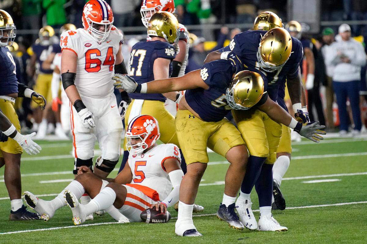 Notre Dame defensive lineman Howard Cross III takes a bow after sacking Clemson quarterback DJ Uiagalelei during the first half of an NCAA college football game Saturday, Nov. 5, 2022, in South Bend, Ind. (AP Photo/Charles Rex Arbogast)
