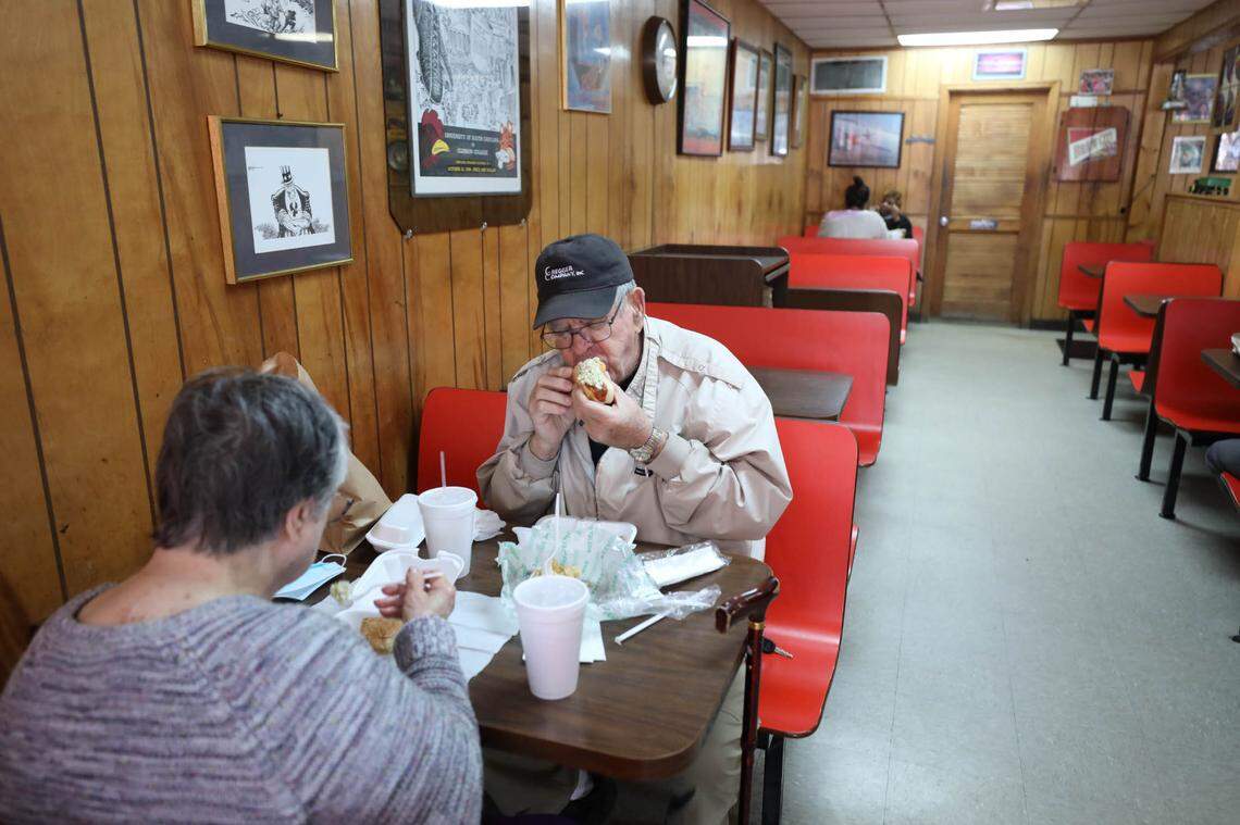 Mack’s Cash Grocery reopened after a 9-month hiatus due to the coronavirus. The burger joint known simply as Mack’s has had a continuous line of customers who have missed their burgers and hotdogs. Here longtime customers Ronald and Myrtice Reese enjoy lunch.
