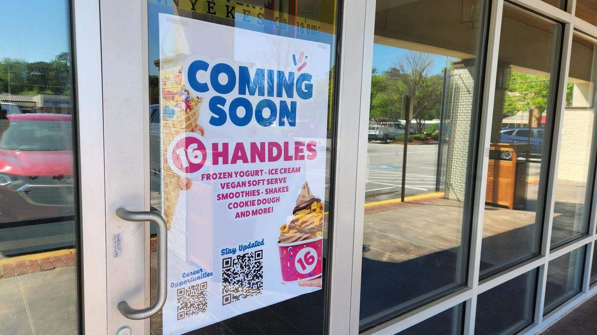 A poster touts that 16 Handles, a frozen yogurt shop, is coming soon to Trenholm Plaza in Forest Acres.