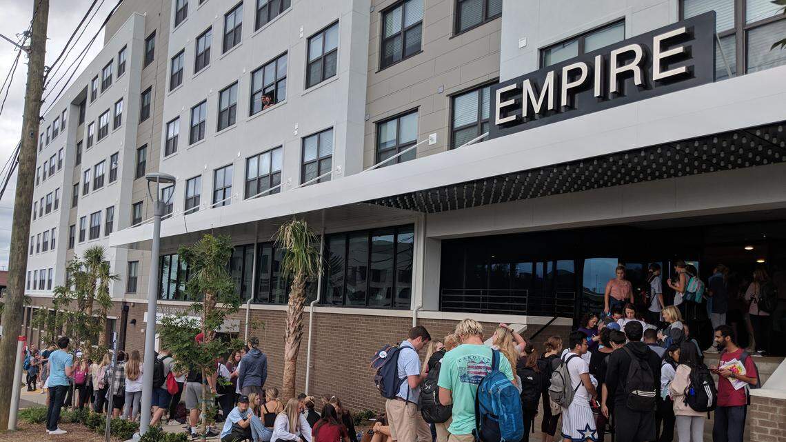Students line the sidewalk on Pendleton Street waiting to sign leases at Empire Columbia on Nov. 1, 2018