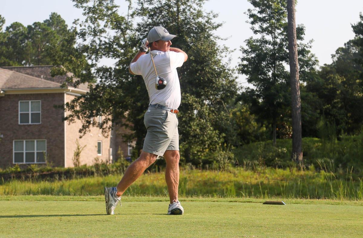 Marcus Satterfield takes a swing during the Birdies with Beamer golf tournament on Thursday, July 29, 2021 at Woodcreek Country Club.
