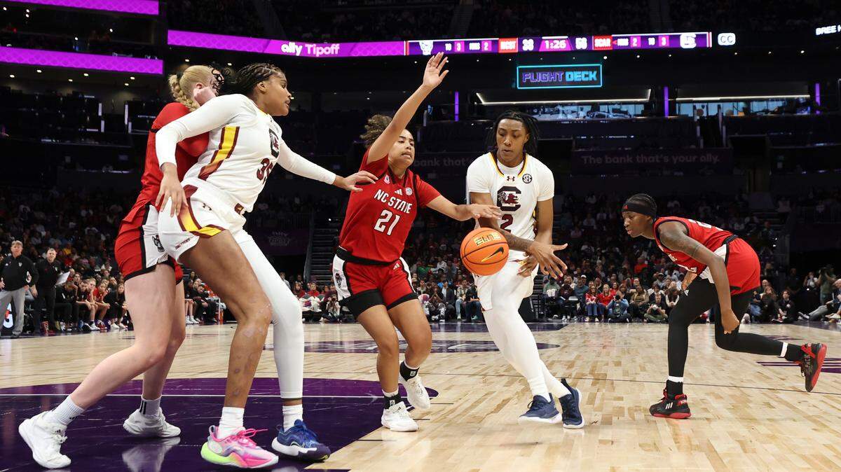 University of South Carolina forward Ashlyn Watkins (2) passes the ball to University of South Carolina center Sakima Walker (35) during the second half of action in the Ally Tipoff at the Spectrum Center in Charlotte on Sunday, Nov. 10, 2024.