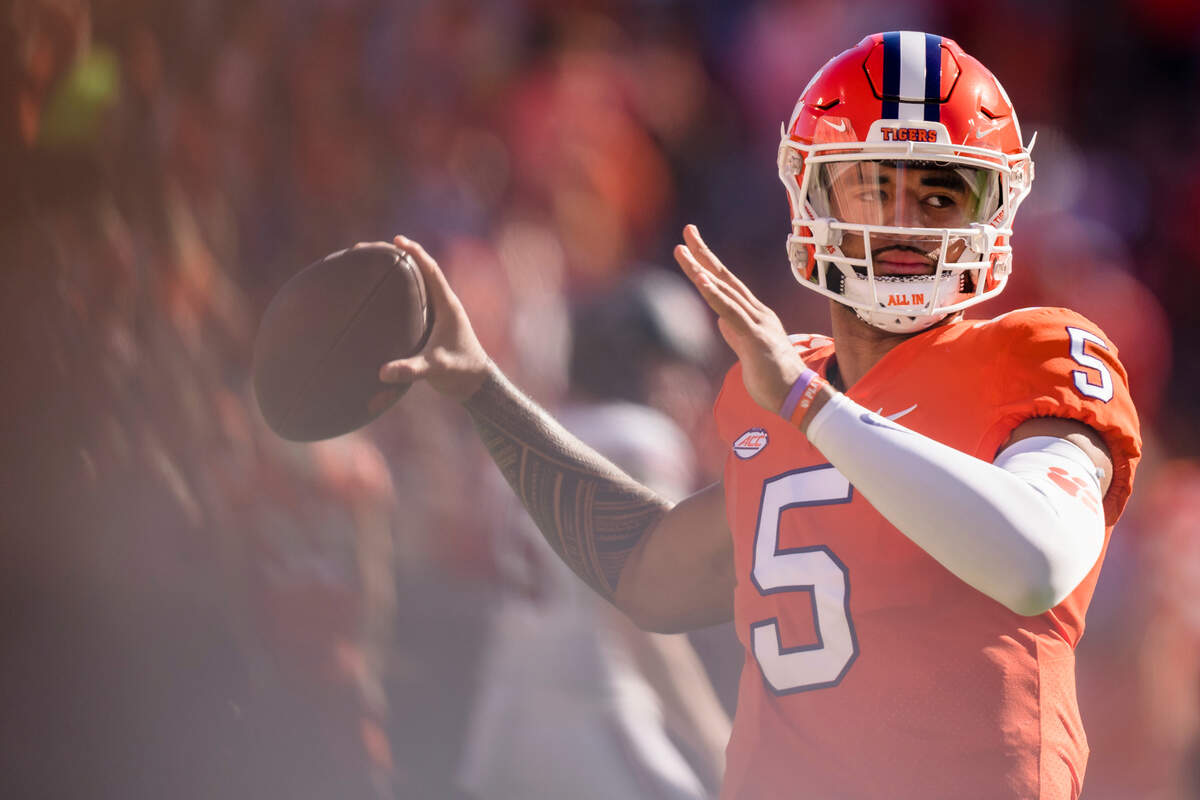 Clemson quarterback DJ Uiagalelei (5) warms up before an NCAA college football game against South Carolina on Saturday, Nov. 26, 2022, in Clemson, S.C. (AP Photo/Jacob Kupferman)