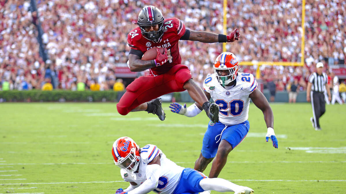 Mario Anderson hurdles a Florida player to score a South Carolina touchdown on Saturday.