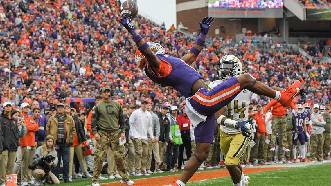 Nov 11, 2023; Clemson, South Carolina, USA; Clemson Tigers receiver Tyler Brown (6) catches a pass for a touchdown against Georgia Tech Yellow Jackets defensive back Jayloh King (14) during the second quarter at Memorial Stadium.