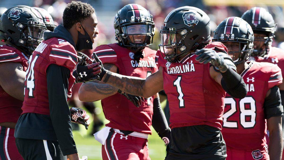 South Carolina defensive back Jaycee Horn (1) celebrates an interception with Israel Mukuamu (24) during the first half of an NCAA college football game Saturday, Oct. 17, 2020, in Columbia, S.C. South Carolina defeated Auburn 30-22. (AP Photo/Sean Rayford)