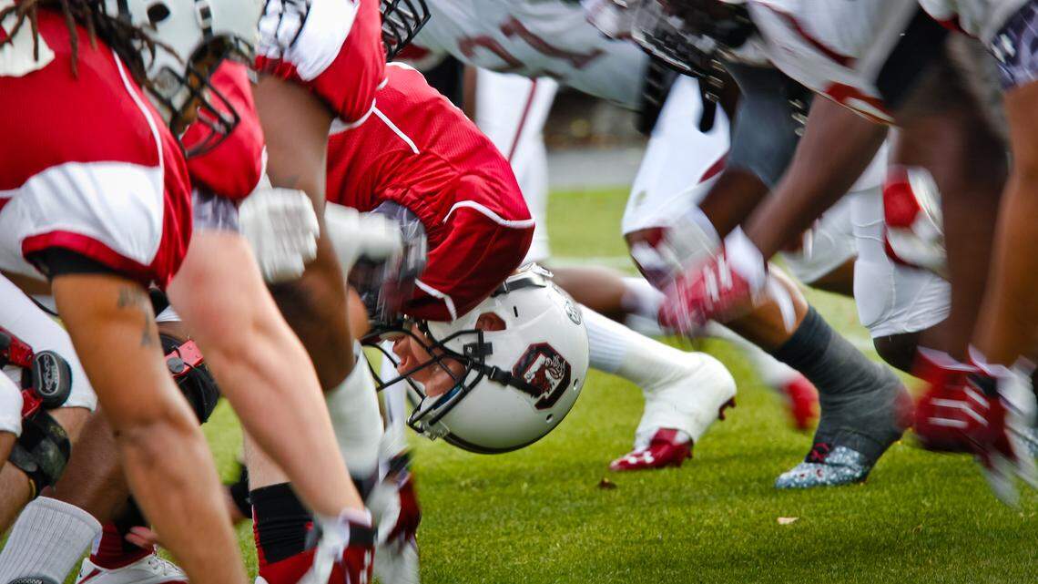 The long snapper keeps his eyes on the target as the defense rushes during punt team drills during the South Carolina football spring scrimmage Saturday at Williams-Brice Stadium.