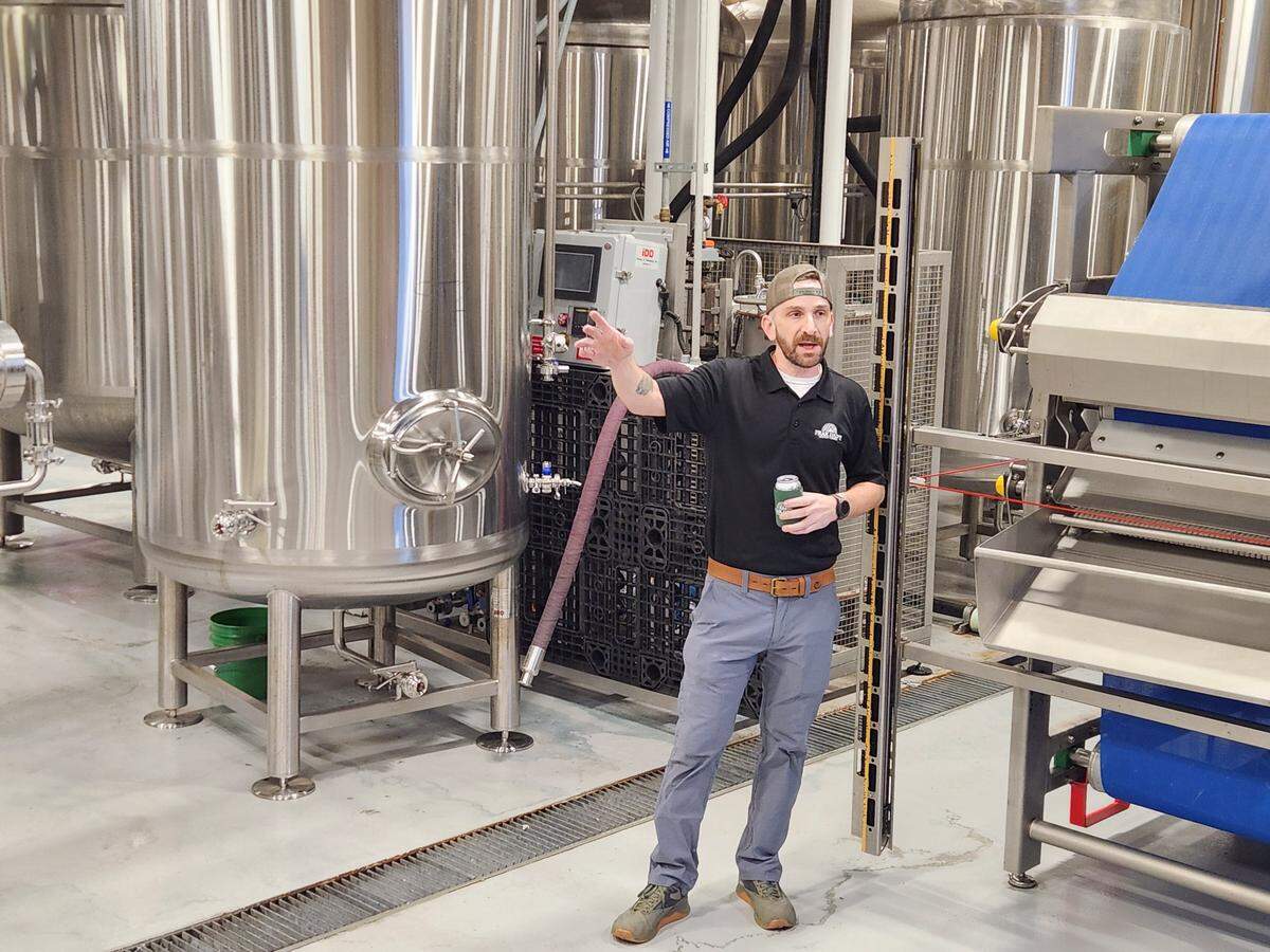 Peak Drift Brewing plant manager Tom Crough talks about the brewing process during a recent tour of the facility at 3452 North Main St. in Columbia.