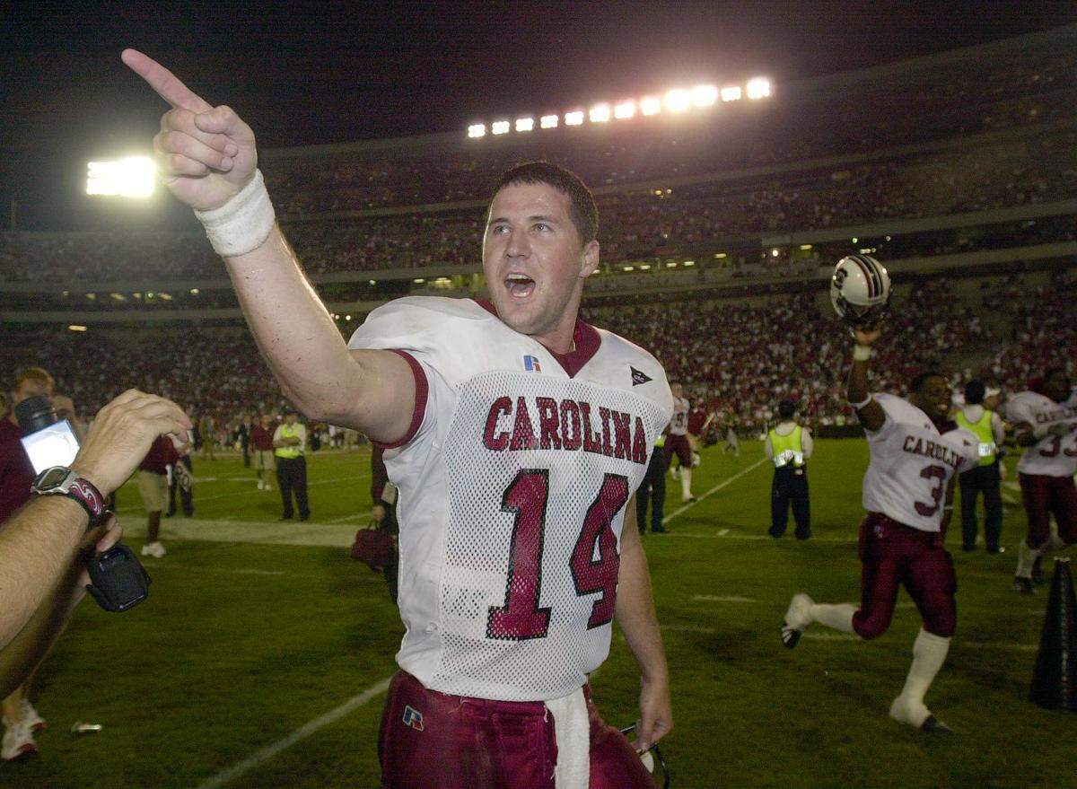 “I told you so!” South Carolina quarterback Phil Petty screams to the crowd after throwing the game-winning pass to receiver Brian Scott late in the fourth quarter in a win over Georgia on Sept. 8, 2001. USC won 14-9.