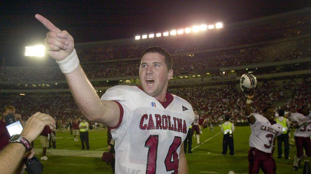 “I told you so!” South Carolina quarterback Phil Petty screams to the crowd after throwing the game-winning pass to receiver Brian Scott late in the fourth quarter in a win over Georgia on Sept. 8, 2001. USC won 14-9.