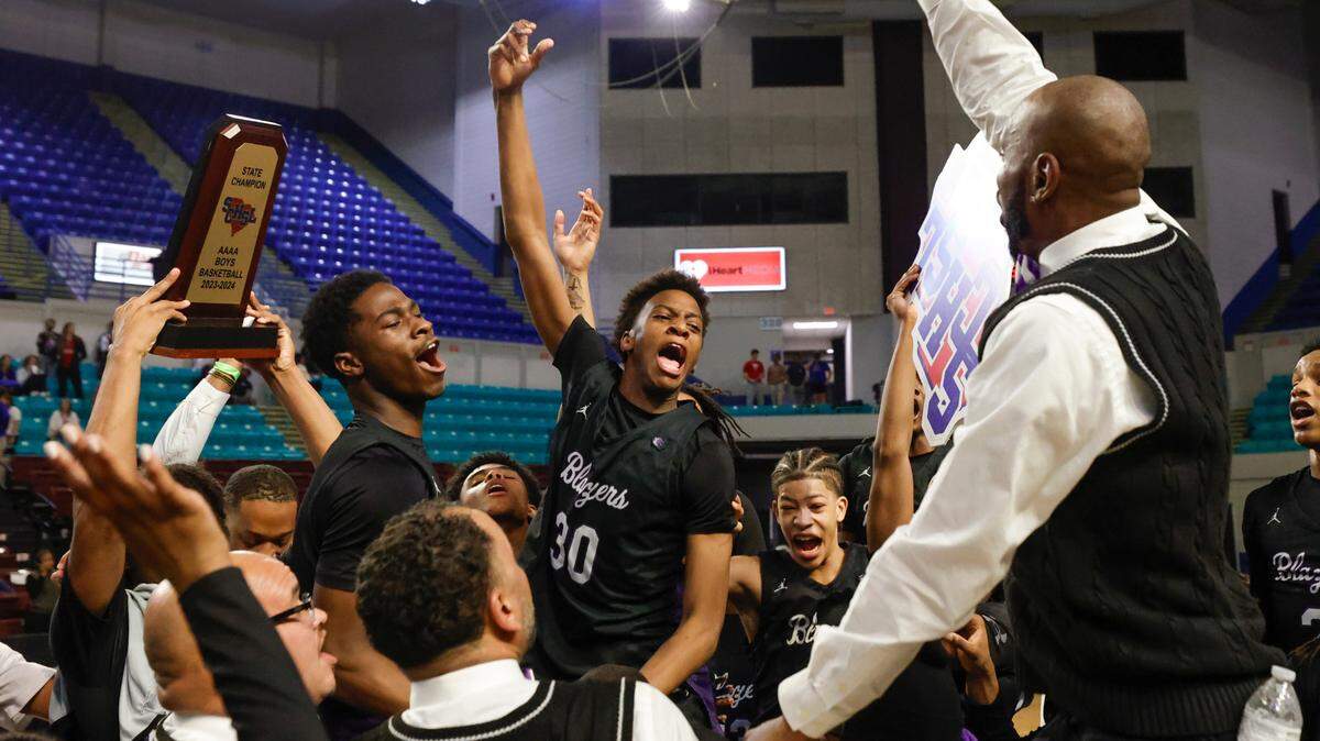 The Ridge View Blazers celebrate winning the Class 4A boys basketball championship game on Saturday, March 2, 2024 at the Florence Center. Ridge View beat Riverside 55-52.