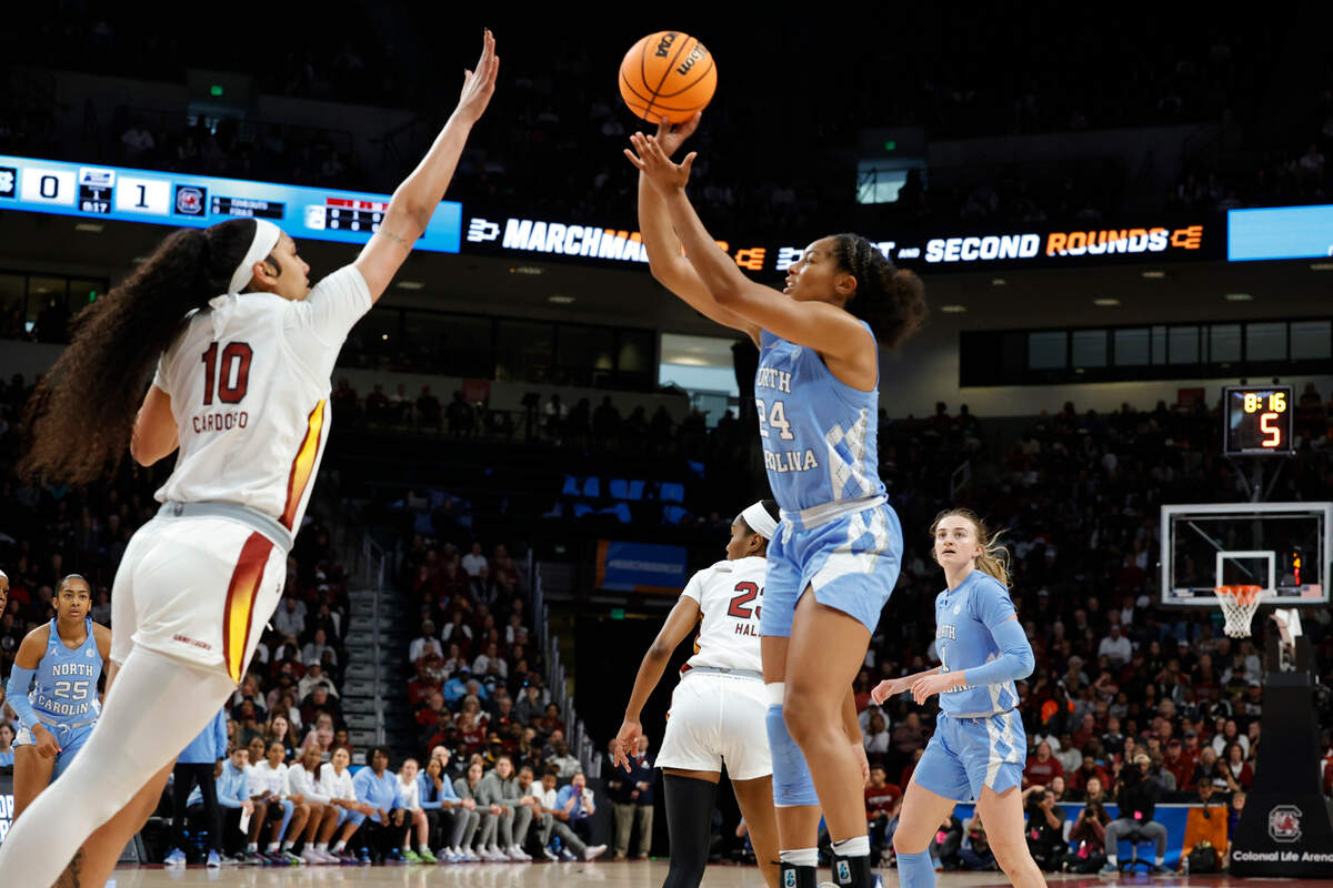 North Carolina’s Indya Nivar (24) shoots as South Carolina’s Kamilla Cardoso (10) pressers during the first half of action in the second round of the NCAA Tournament at the Colonial Life Arena in Columbia, SC, on Sunday, March. 24, 2024.