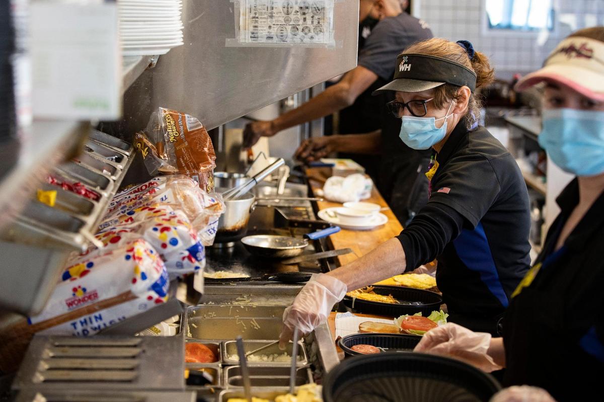Myrtle Whitman prepares to go orders at the Waffle House she manages on Wednesday, February 17, 2021. Since the coronavirus hit South Carolina, Waffle House has prepared far more to go orders than normal.