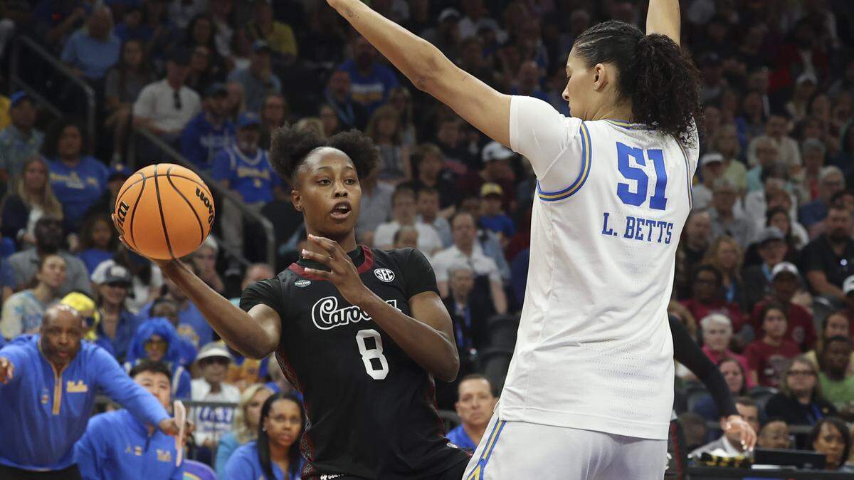 South Carolina's Joyce Edwards (8) passes as UCLA’s Lauren Betts (51) pressures during their women's basketball game for the NCAA national championship against UCLA at Mortgage Matchup Center in Phoenix on Sunday.