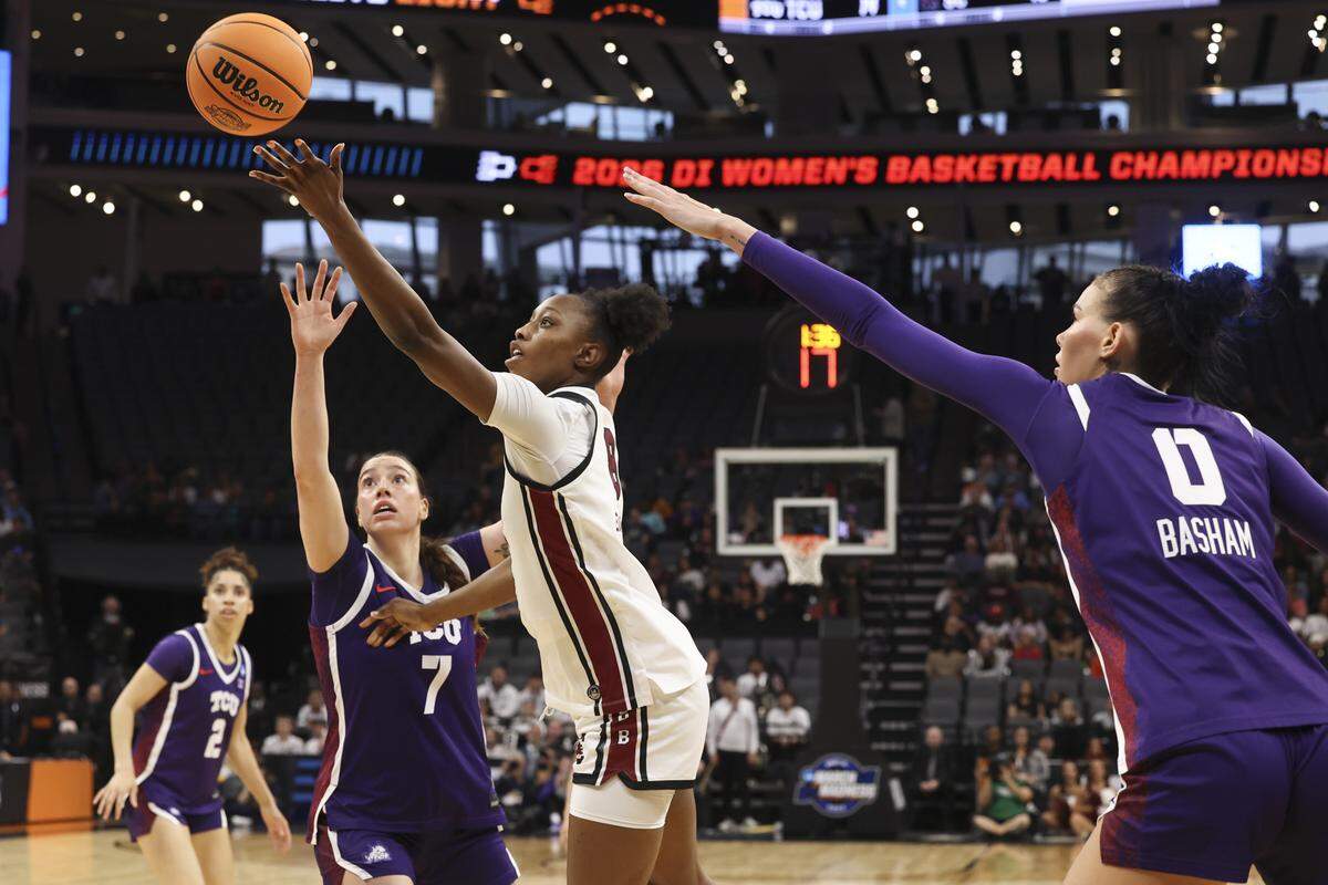 South Carolina's Joyce Edwards (8) shoots as TCU’s Marta Suarez (7) and Kennedy Basham (0) pressure during the first half of action of their Elite Eight women's basketball game against TCU at Golden 1 Arena on Monday, March 30, 2026.