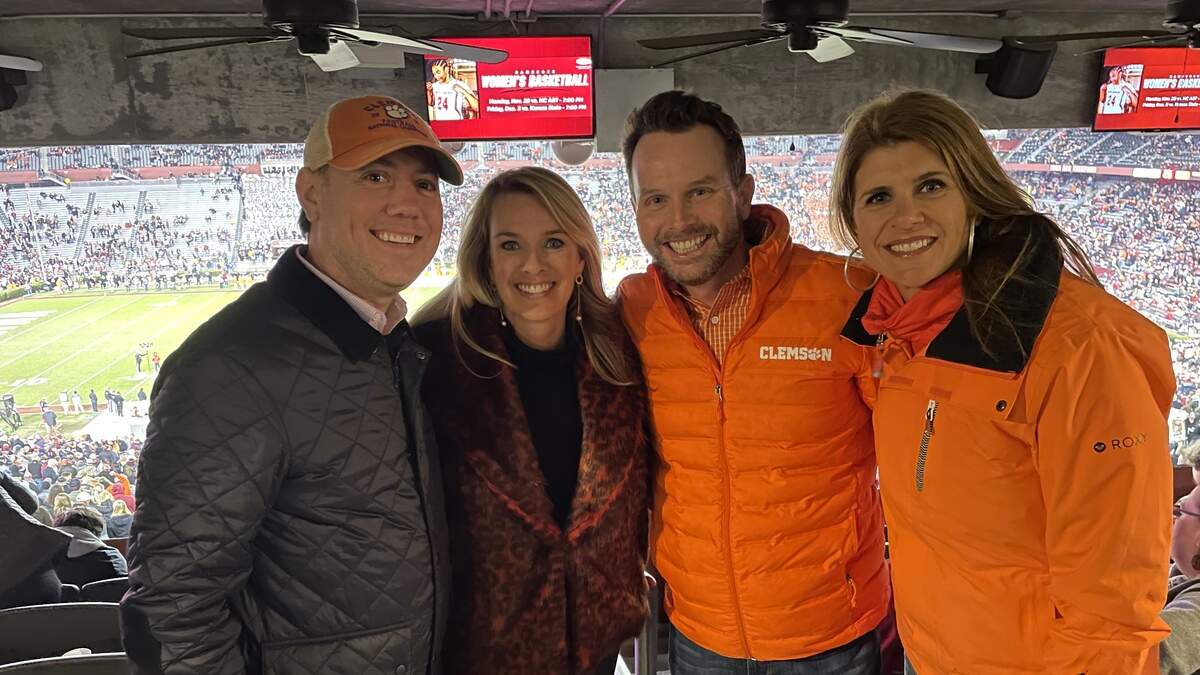 From left to right: James Brogdon (Clemson ‘07 // USC Law ‘10) with his wife, Elizabeth (a South Carolina alum) and friends Steve and Laura Cloud at the Clemson vs. South Carolina football game in 2023.