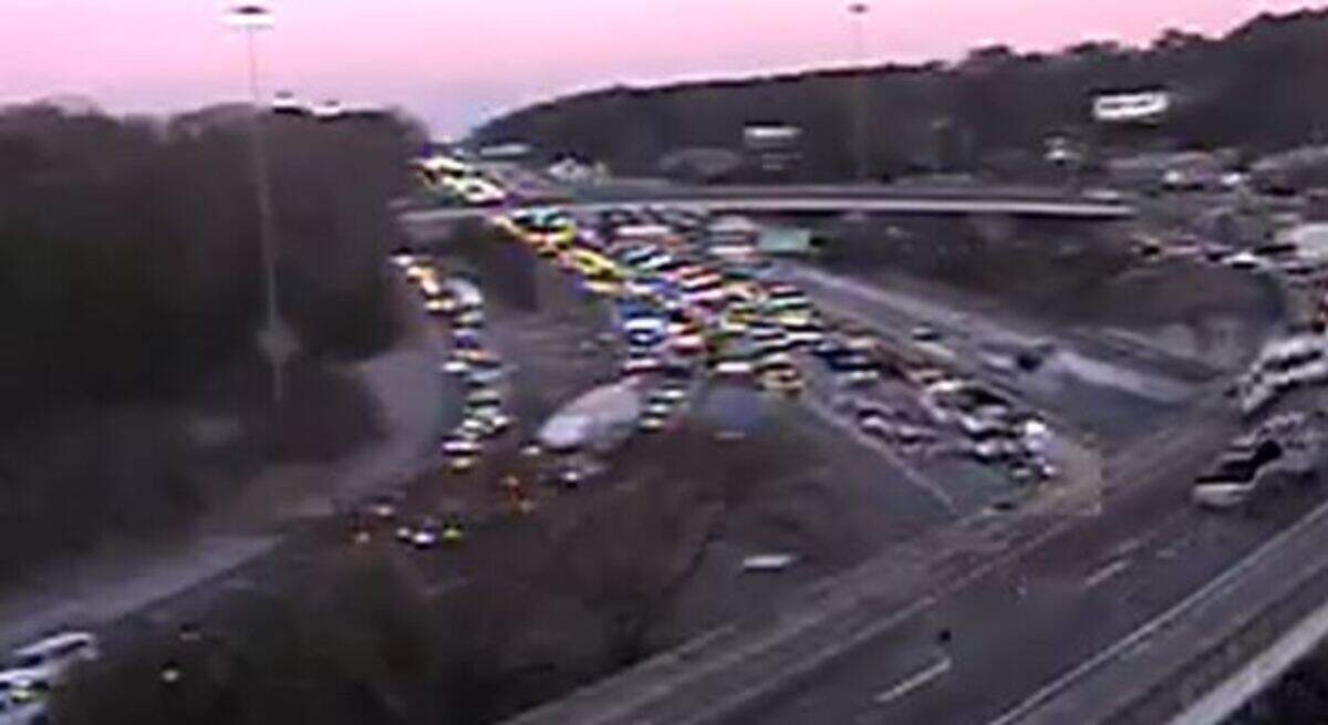 Vehicles are backed up following a collision.
