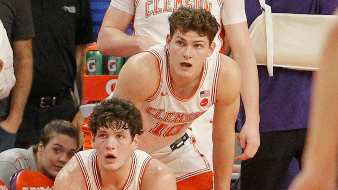Clemson forward PJ Hall (24), forward Ben Middlebrooks (10), and forward Ian Schieffelin (1) watch closely as North Carolina heads down the court during second-half action on Tuesday, Feb. 8, 2022 in Clemson. Forward Hunter Tyson (right) also looks on.