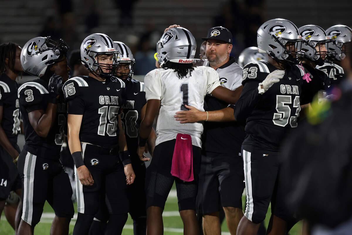 Brookland-Cayce quarterback Dre Dopson (1) shakes hands with Gray Collegiate coaches and players after Tuesday’s game.