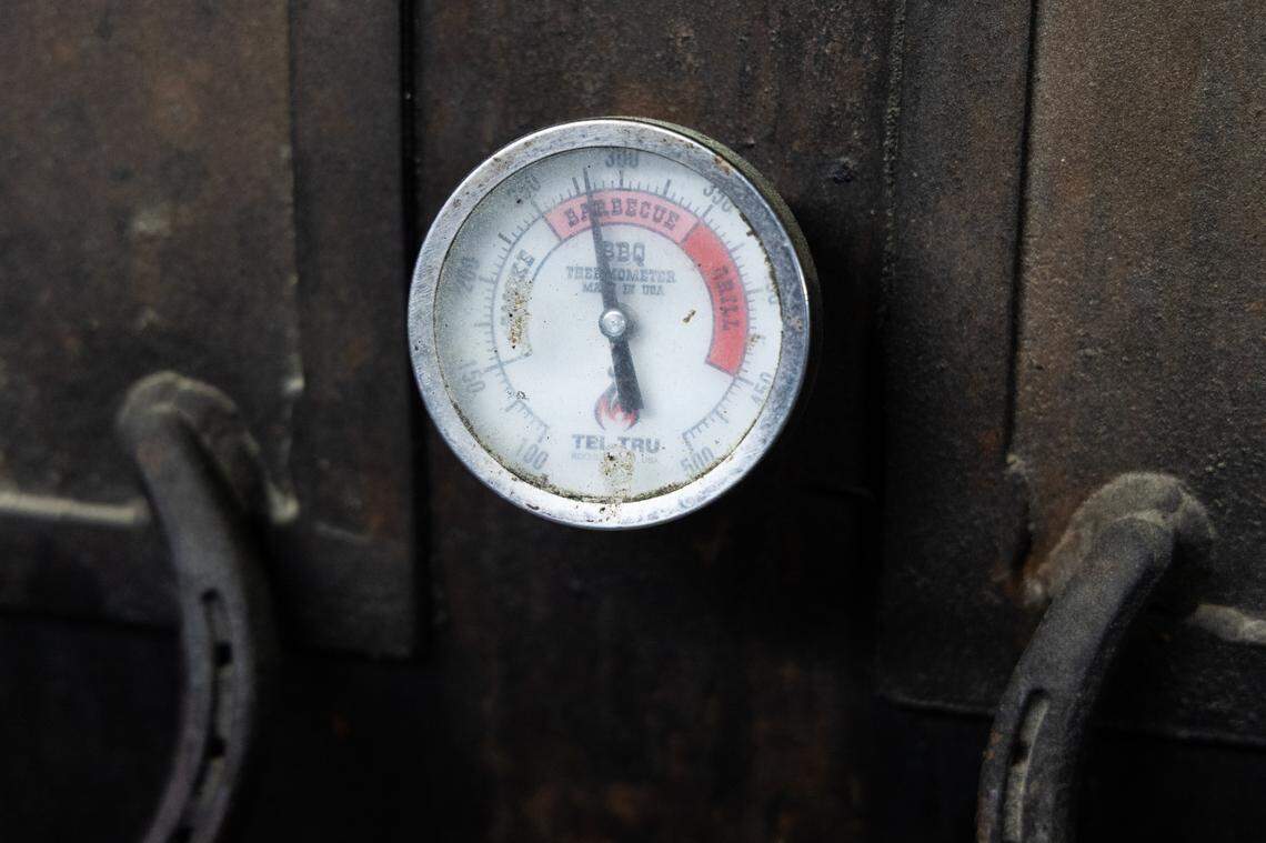 A thermometer on the outside of “Megatron,” one of the smokers at City Limits Barbeque in West Columbia, on Friday, March 28, 2025.