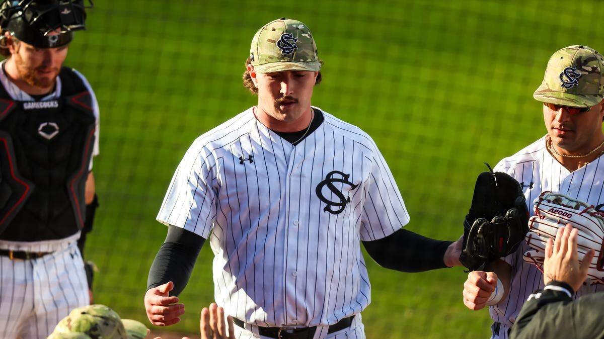 South Carolina Gamecocks pitcher Brandon Stone (32) receives high fives after completing the second inning against the Air Force Falcons at Founders Park, 2/22/26.