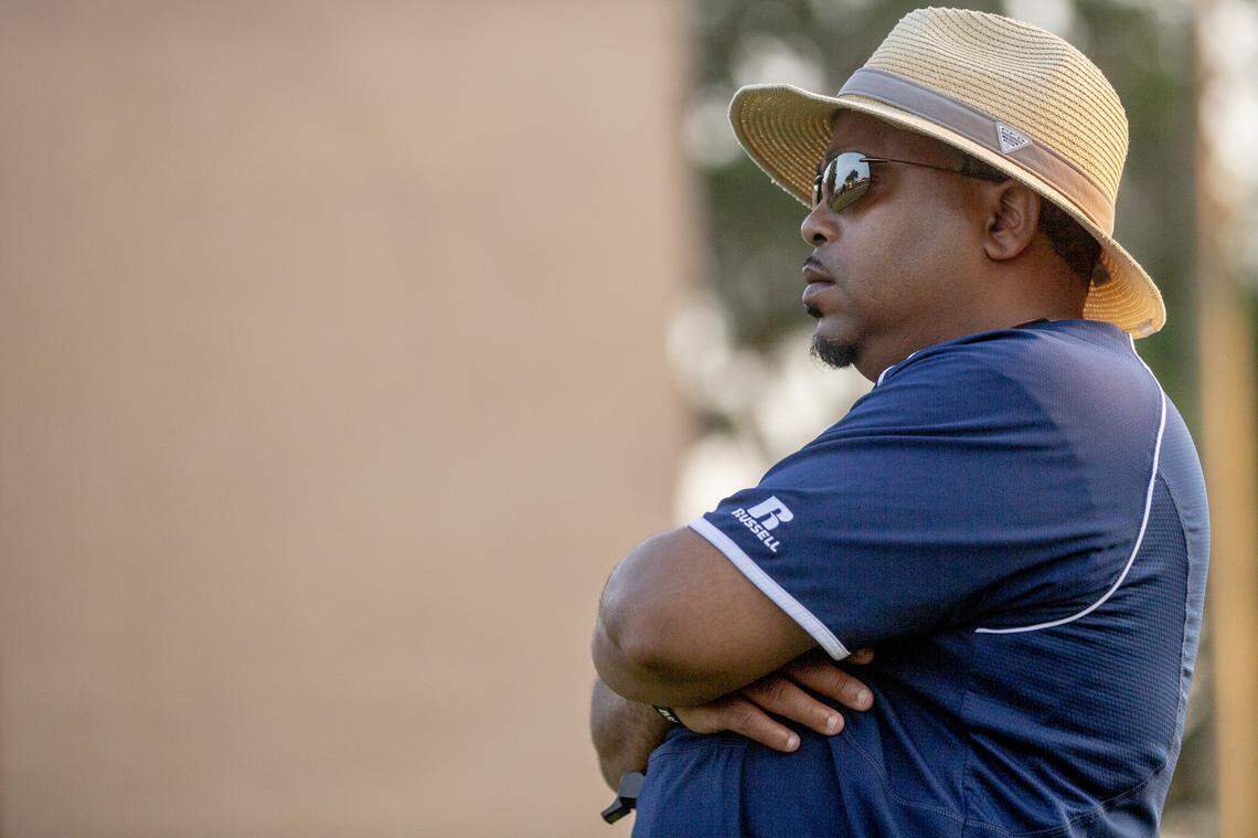 Allen University head football coach Ted Keaton watches a team scrimmage during practice.
